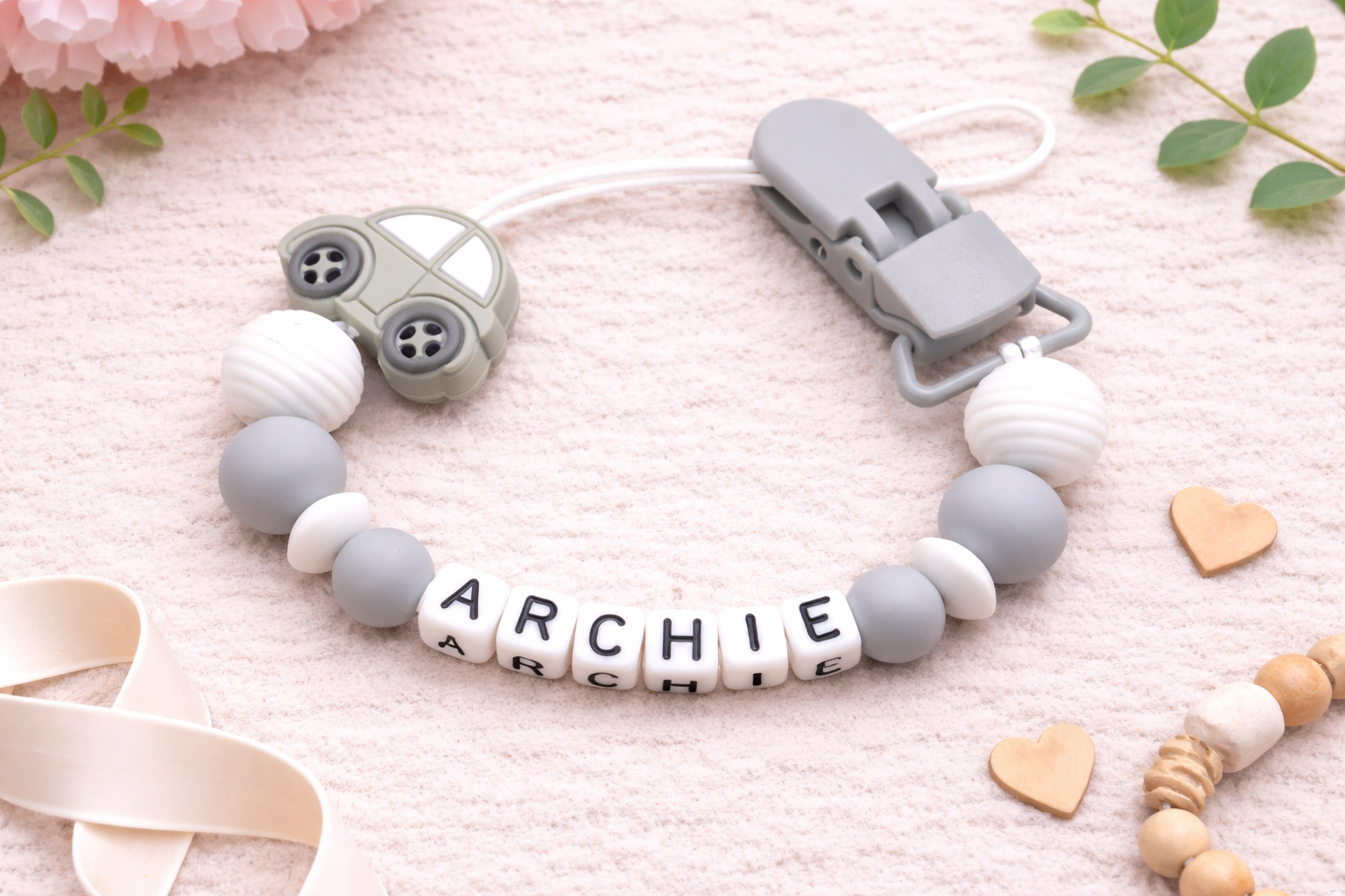 dummy clip with name 'Archie' on a soft pink background