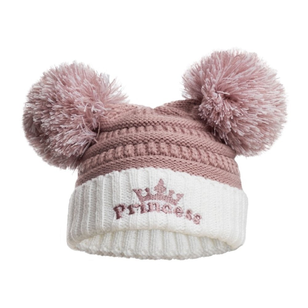 Knitted baby hat with two pink pom-poms and 'Princess' embroidery on a white background