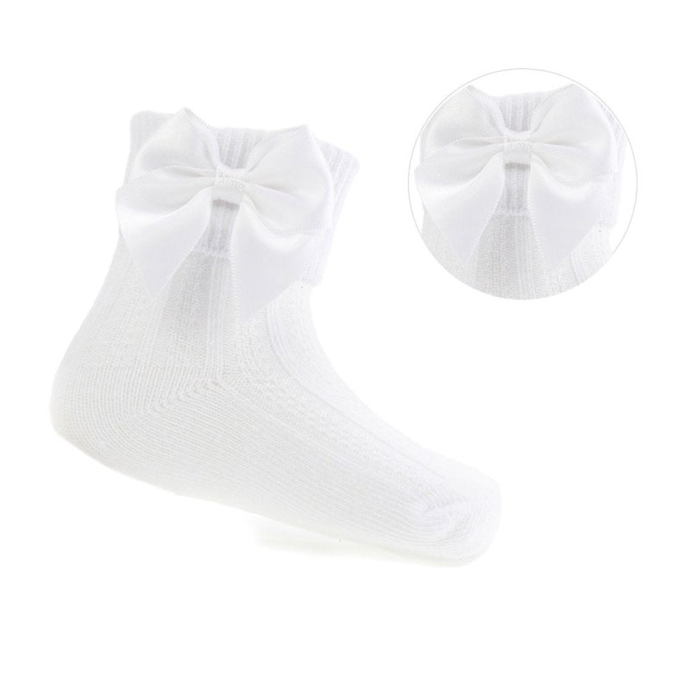 White socks with a large bow on a white background
