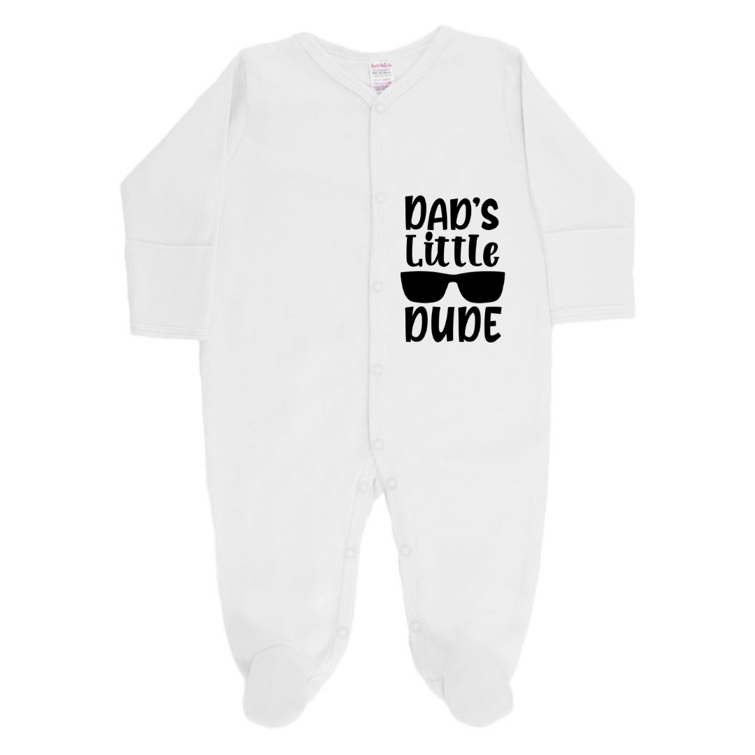 White baby onesie with 'Dad's Little Dude' text and sunglasses graphic on a white background